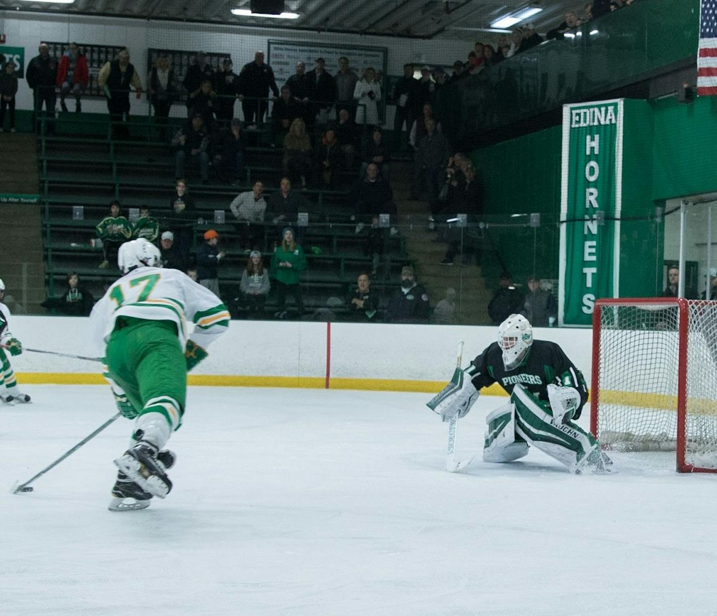 Edina's Ben Brinkman prepared to shoot the puck against the Hill-Murray goaltender in a game at Braemar Arena on Jan. 21, 2017.