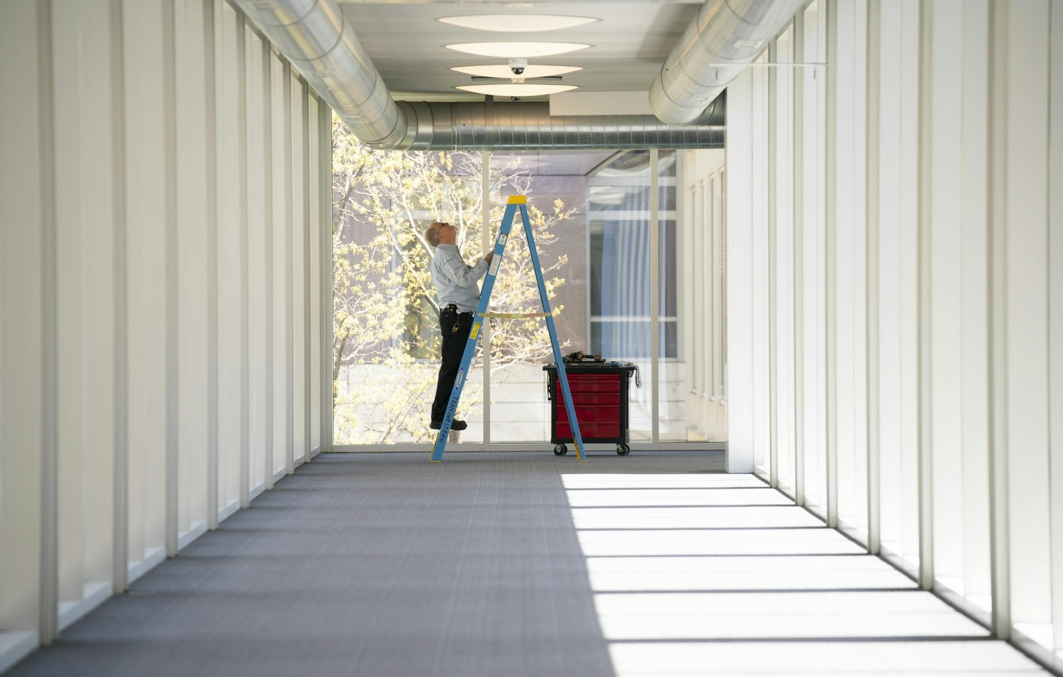 A maintenance worker changed air filters in the deserted skyway over 3rd Ave. S. Tuesday afternoon.