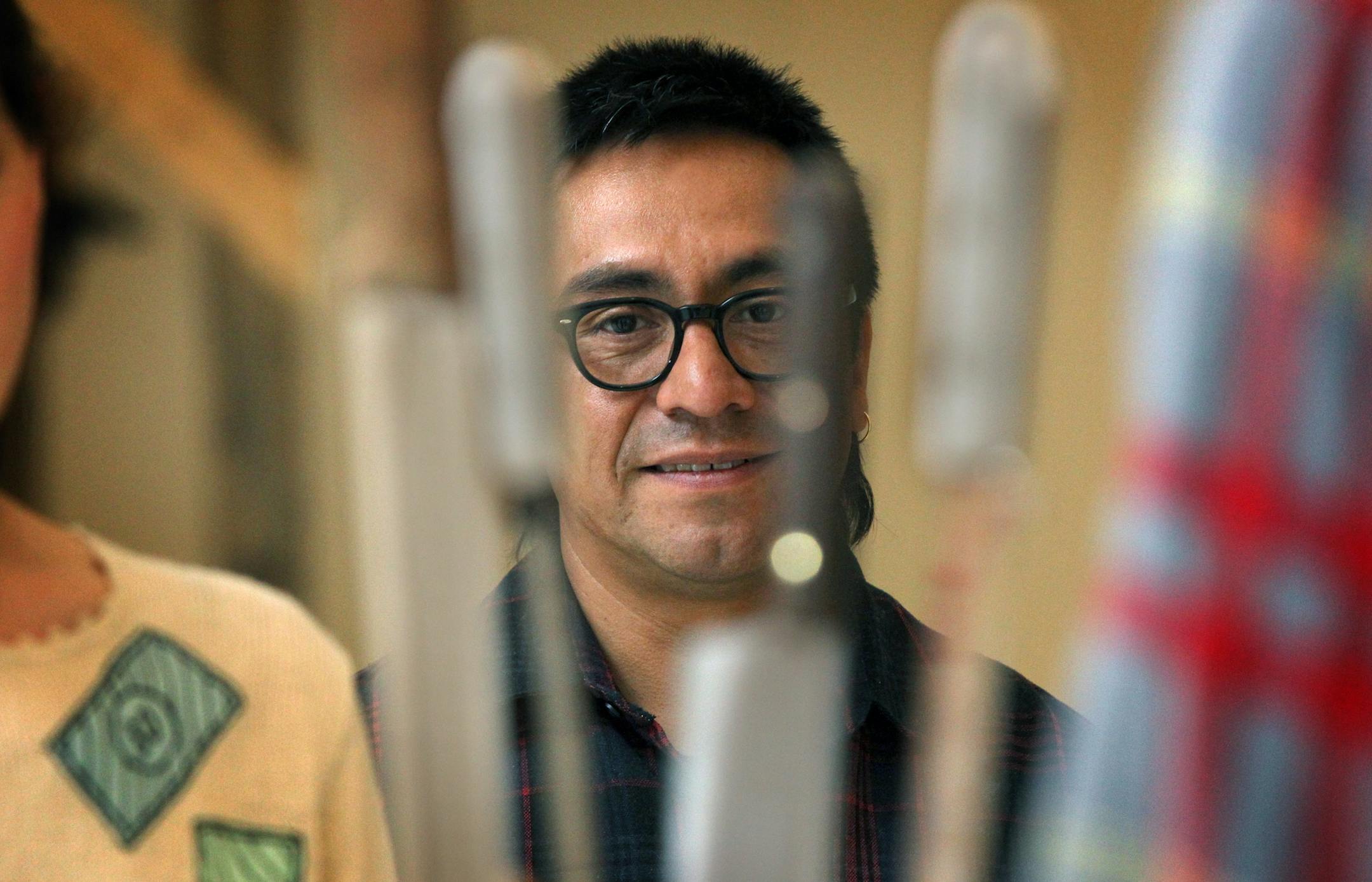 Mexico City-based artist Abraham Cruzvillegas at his installation at the Walker Art Center. Sculptures and installations by Mexico City-based artist Abraham Cruzvillegas are featured at Walker Art Center in the artist's first mid-career exhibit. [ STAR TRIBUNE/TOM WALLACE Assignments #20028144A March 22, 2013 SLUG 72130 abbe032913 EXTRA INFORMATION Mary Abbe reporter. Artist and curator at the gallery.