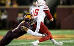 Gophers defensive back Chris Williamson tackled Cornhuskers quarterback Noah Vedral for a loss of yards in the first half. Vedral was starting for the