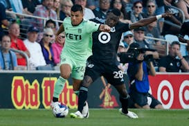 Minnesota United forward Mender García fouls Austin FC defender Nick Lima as they vie for the ball in the first half Saturday