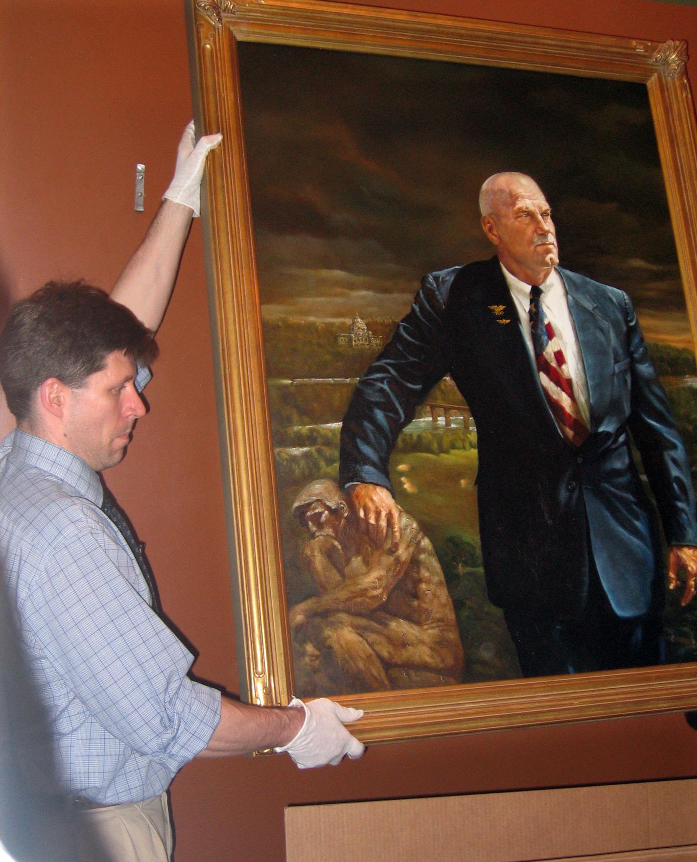 A conservator removed the official portrait of former Gov. Jesse Ventura after it was defaced with a red marker.