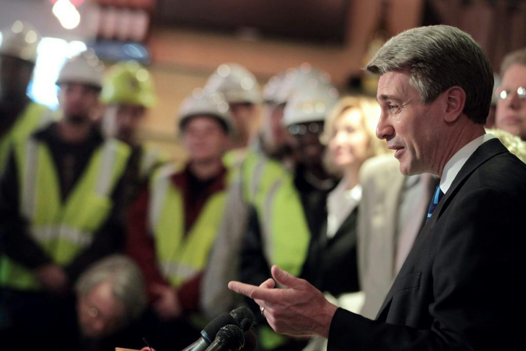 Minneapolis Mayor R.T Rybak a flanked by City Council president Barbara Johnson left and William McCarthy, President of Minneapolis Regional Labor Federation announced workforce agreements that will create good jobs at a new Vikings stadium at the Metrodome. ..