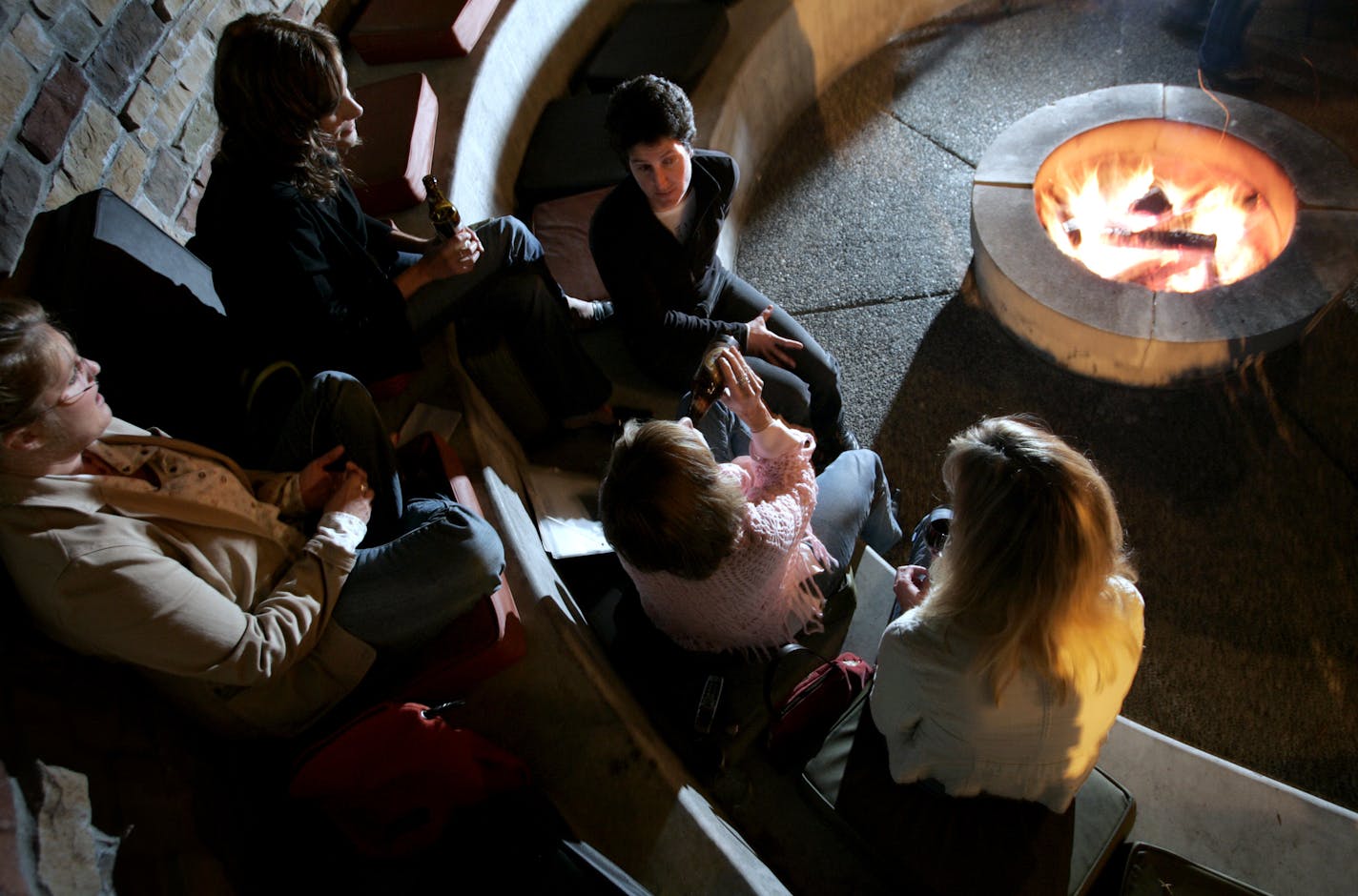 In this file photo, people gather around the fire at Tryg's Restaurant in Minneapolis.