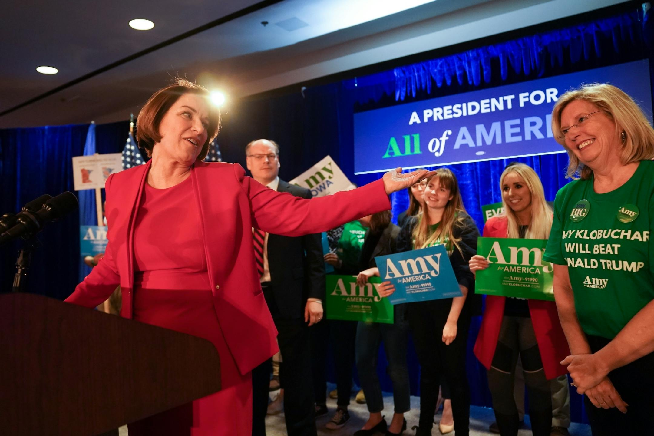 Amy Klobuchar spoke to supporters at her caucus night party Monday night in Des Moines. Behind her is former Iowa Democratic Party Chairwoman Andy McGuire, Klobuchar's local campaign chair.