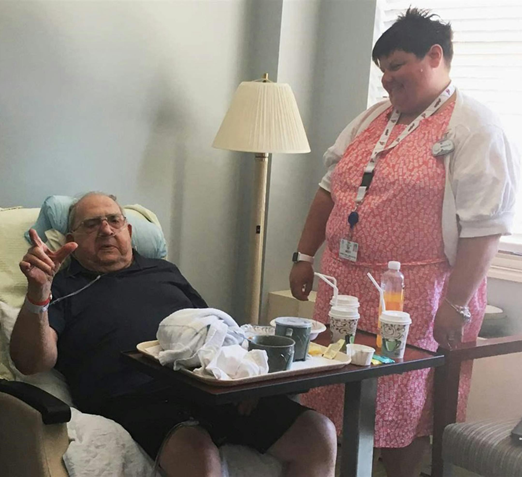 A hospice social worker, Misty Durbin, talks to Marty Krupar, 87, about his impending transfer to a nursing home for veterans. He recovered from respiratory failure after a monthlong stay at the Ames Family Hospice House in Westlake, Ohio. His wife died the day after he was admitted. (Michael Ollove/Pew Charitable Trusts/TNS)