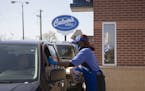Culver's employee Teesha Nelson hands a drive-thru customer their order on Nov. 8, 2021, outside the restaurant chain's newest location in Pullman on 