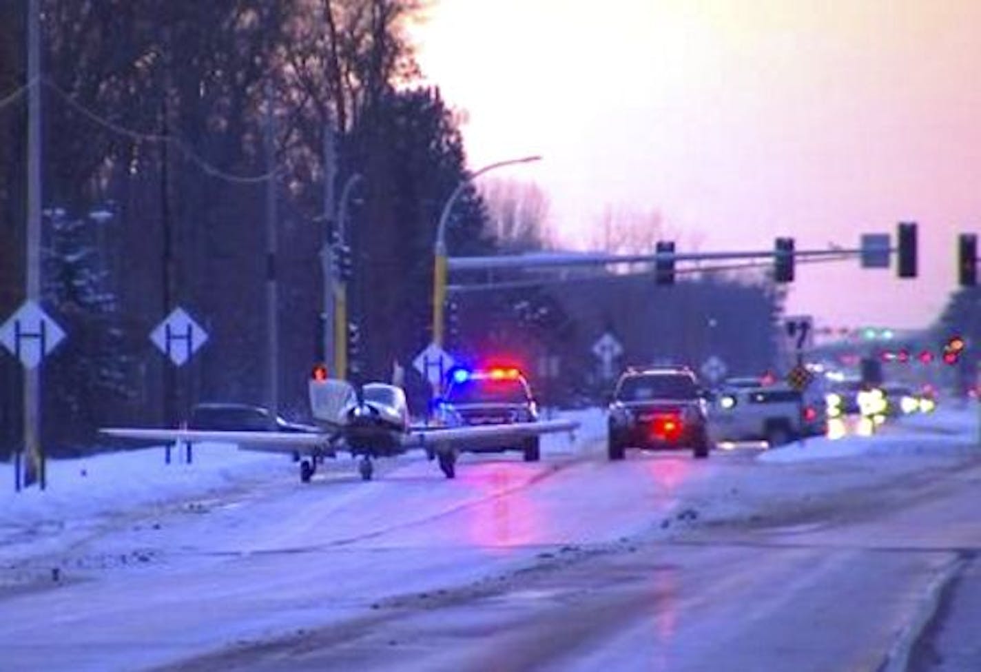 A single engine airplane made an emergency landing on 125th Avenue in Blaine Sunday evening. No one was injured but the plane's wings were damaged on the way down, hitting a street sign. Credit Fox News/KMSP