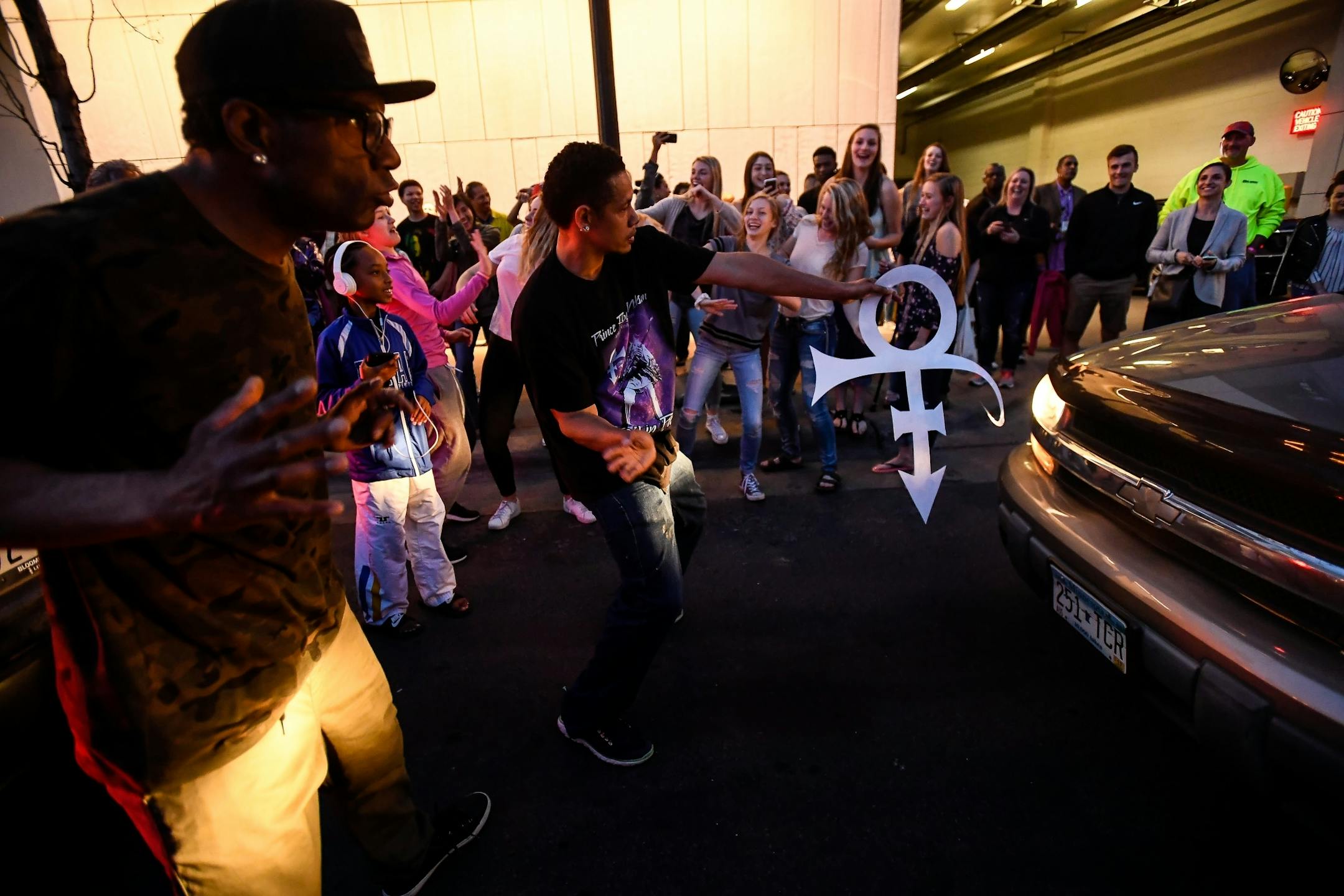 Prince fans blocked traffic on 7th Street outside the barrier containing First Ave's Prince Memorial block party.