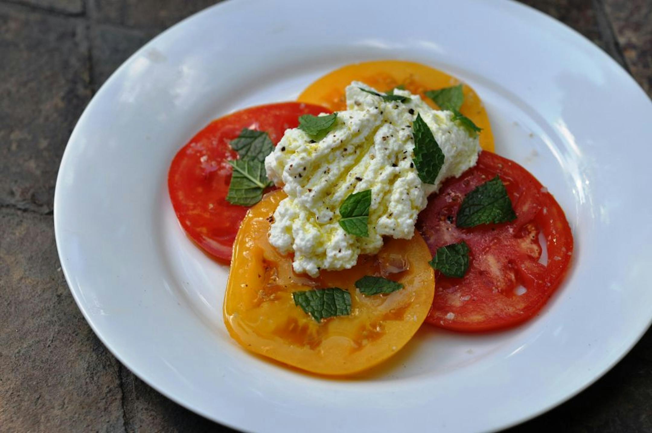 For a summer treat, try homemade ricotta with garden-fresh tomatoes.