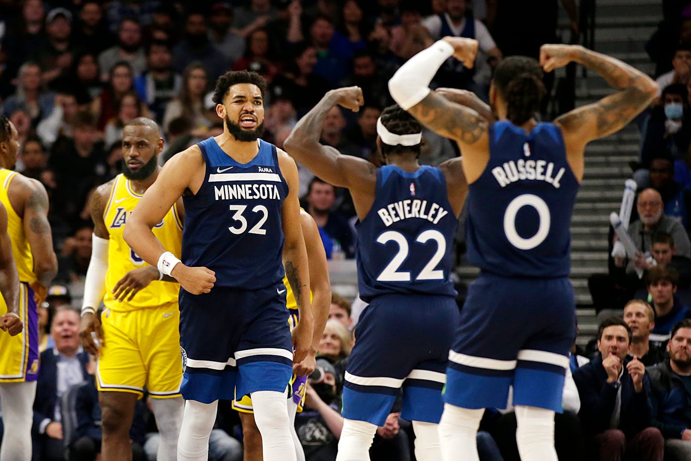 Timberwolves center Karl-Anthony Towns celebrates with Patrick Beverley and D'Angelo Russell during the second half Wednesday against the Los Angeles Lakers