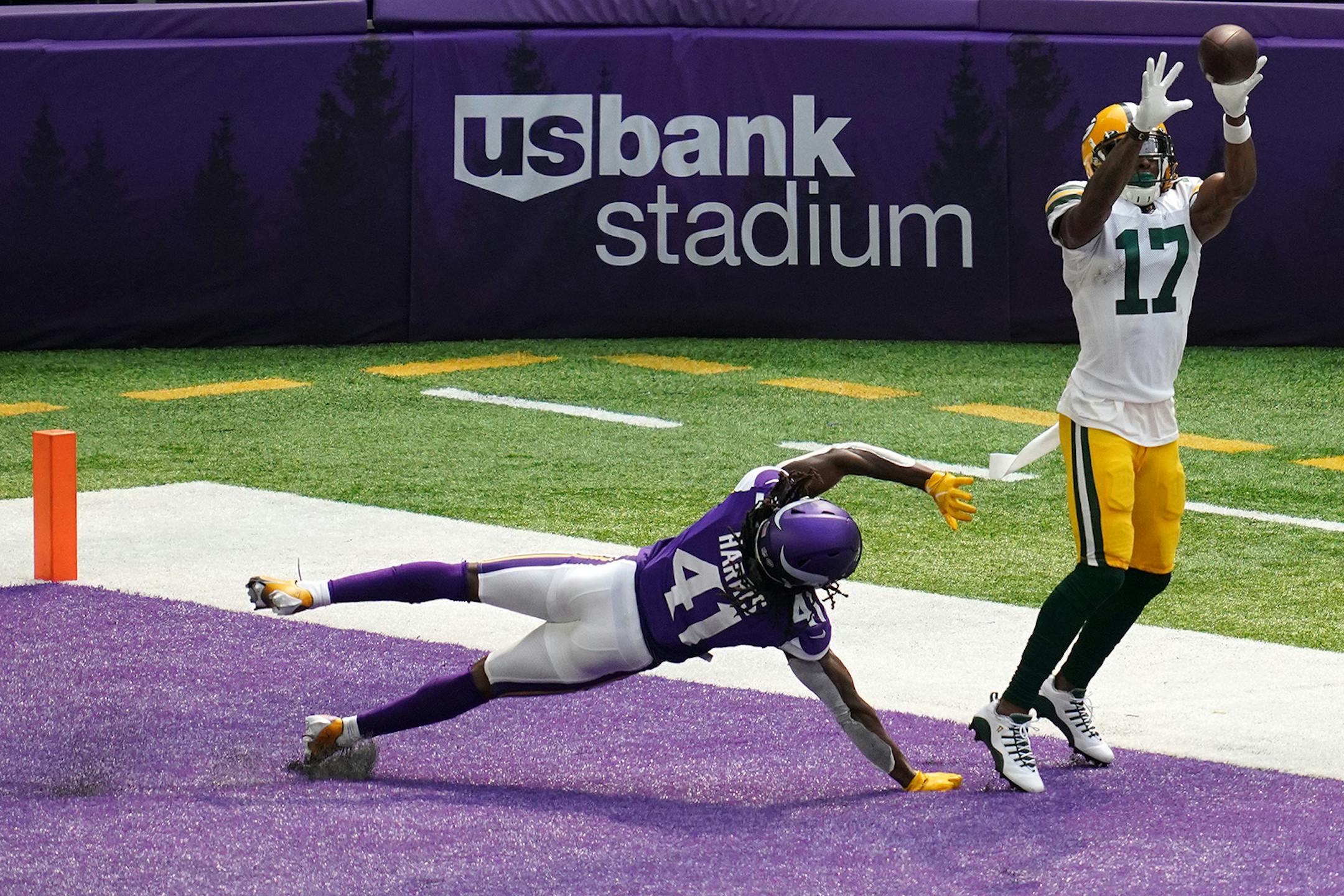 Green Bay Packers wide receiver Davante Adams (17) hauled in a pass four a touchdown as Minnesota Vikings defensive back Anthony Harris (41) in the second quarter.