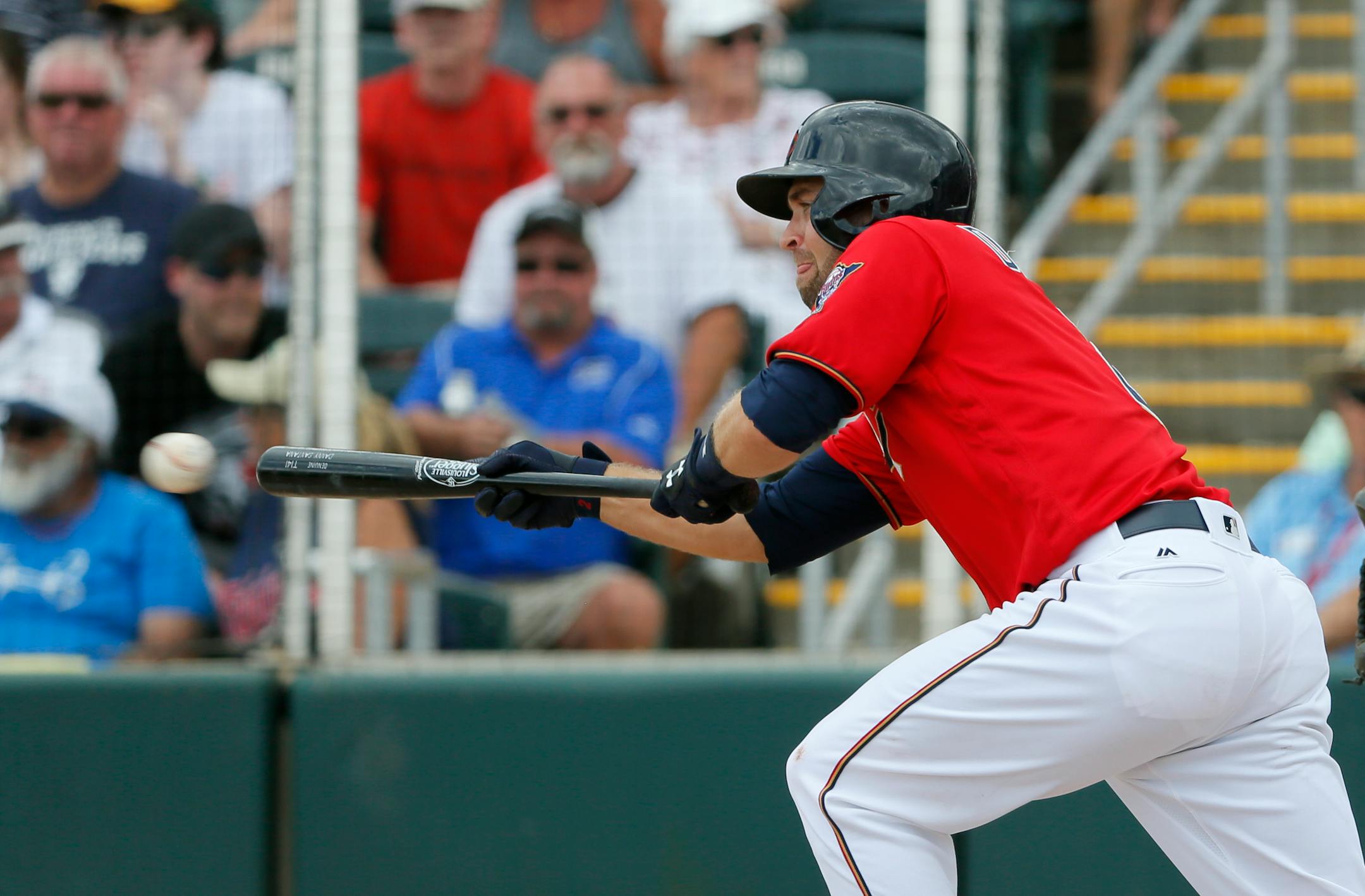 The Twins' Brian Dozier bunted for a single off Blue Jays pitcher Gavin Floyd in the fifth inning Wednesday in Fort Myers, Fla.