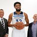 Minnesota Timberwolves' Karl-Anthony Towns, center, poses with new team ownership partners Marc Lore, right, and baseball great Alex Rodriguez, left, 