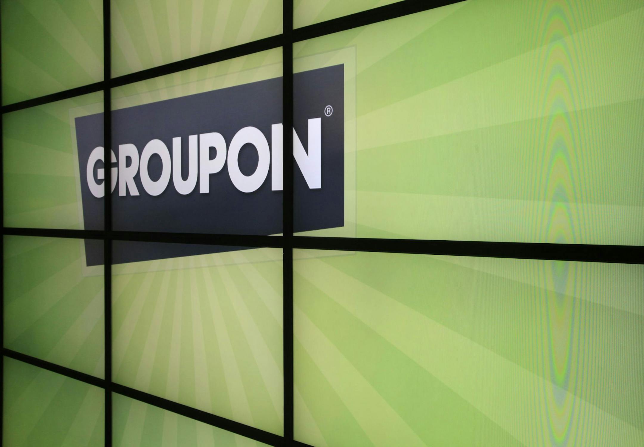 he Groupon logo inside the online coupon company's offices Thursday, Sept. 22, 2011, in Chicago. Online coupon seller Groupon Inc. is discounting its expectations for its first stock offering, reported Friday, Oct. 21, 2011. The company, which offers consumers daily discounts targeted to their city and preferences, now expects net proceeds of about $478.8 million from its initial public offering of 30 million shares. (AP Photo/Charles Rex Arbogast) ORG XMIT: MIN2013022820453705 ORG XMIT: MIN1302