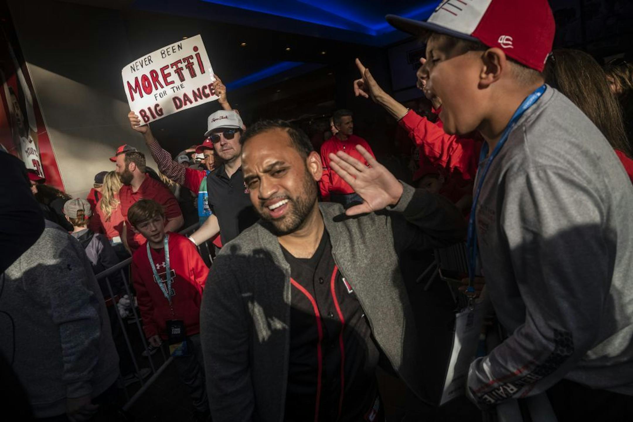 Texas Tech fans including Braylon Benton,10, whose parents went to Texas Tech send their team off as it heads to U.S. Bank Stadium to face Virginia.