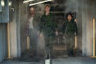 From left, Dan Stevens, Rebecca Hall and Kaylee Hottle in a scene from "Godzilla x Kong: The New Empire."