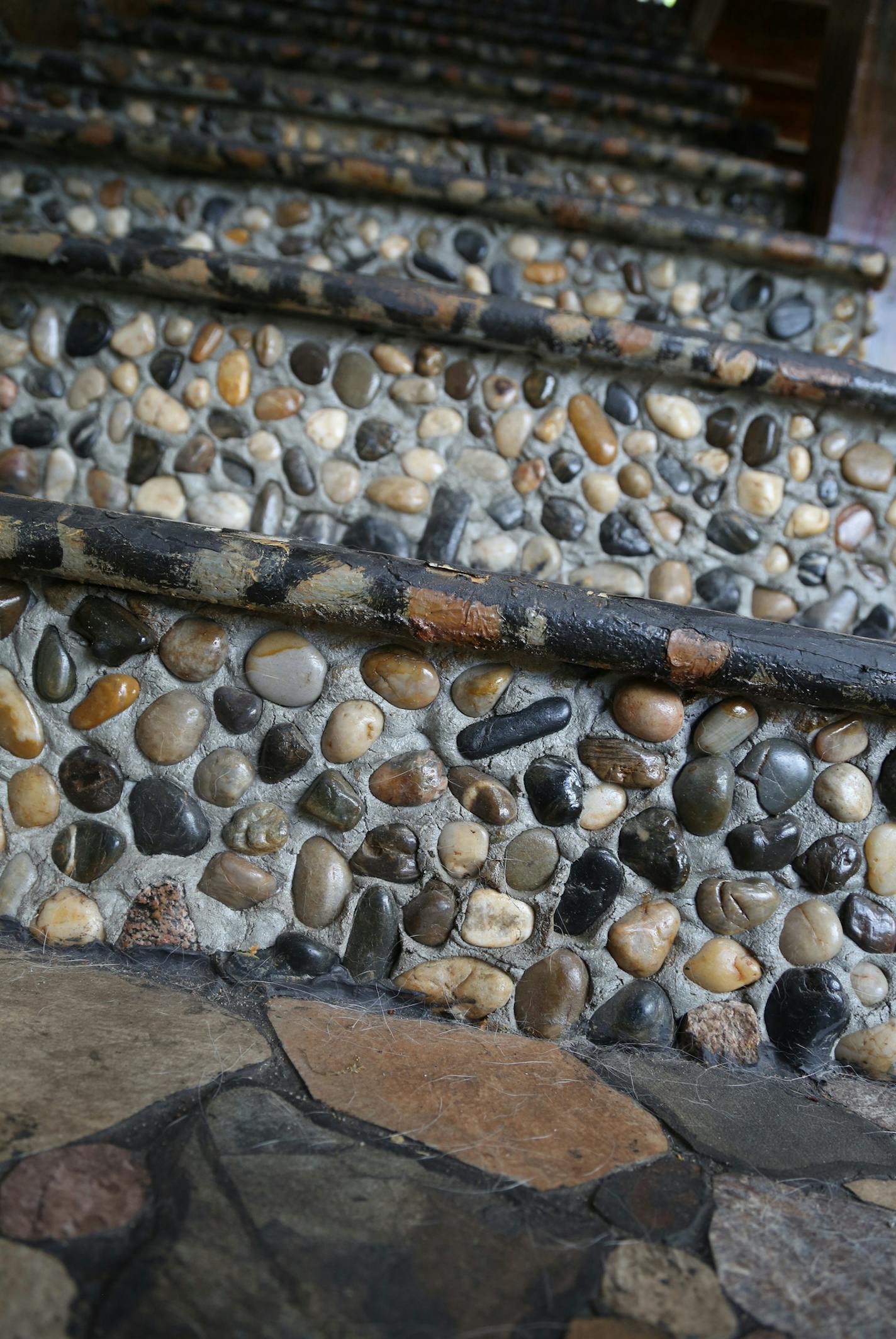 Lauri Svedberg found most of these stones and decorated these stairs and other suffices of her house with them. ] (KYNDELL HARKNESS/STAR TRIBUNE) kyndell.harkness@startribune.com Lauri Svedberg's home she is putting on the market in Minneapolis Min., Friday, May 8, 2015.