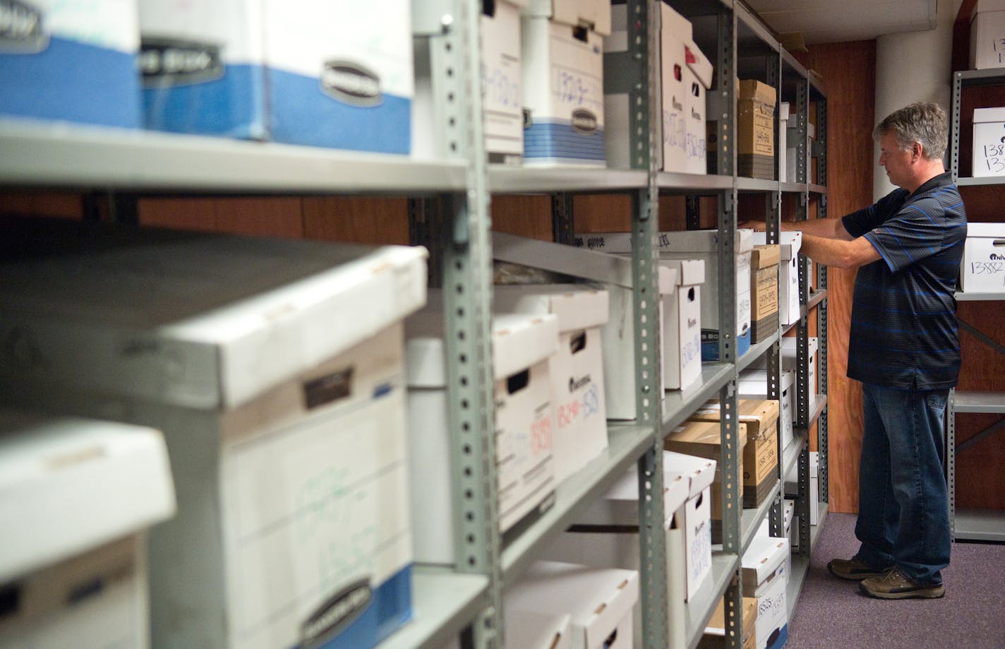 Director of Unclaimed Property, Scott Halvorson completes maintenance inside the Minnesota Department of Commerce's vault of unclaimed funds and property. ] (SPECIAL TO THE STAR TRIBUNE/BRE McGEE) **Scott Halvorson (Director of Unclaimed Property, Minnesota Department of Commerce)