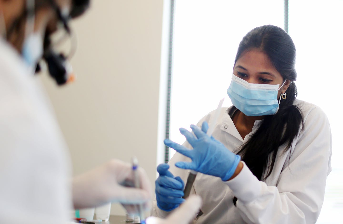 A new immigration policy allows Neeharika Bhashyam to work as a dental assistant at Reflections Dental Care in Brooklyn Park.