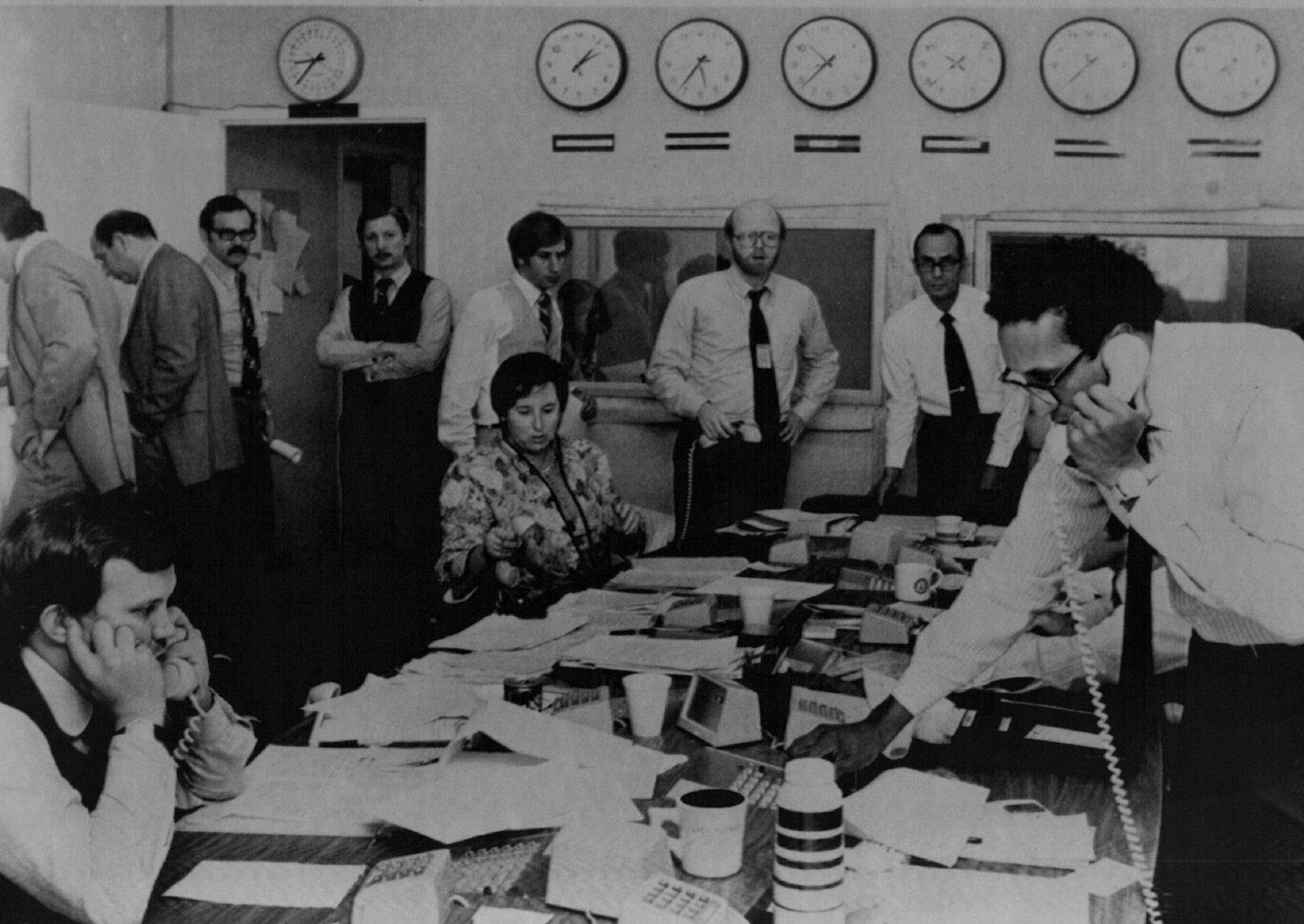State Department officials monitored teletypes and making calls to gather information in the Iran crisis room in Washington after the hostages were taken on Nov. 4, 1979.