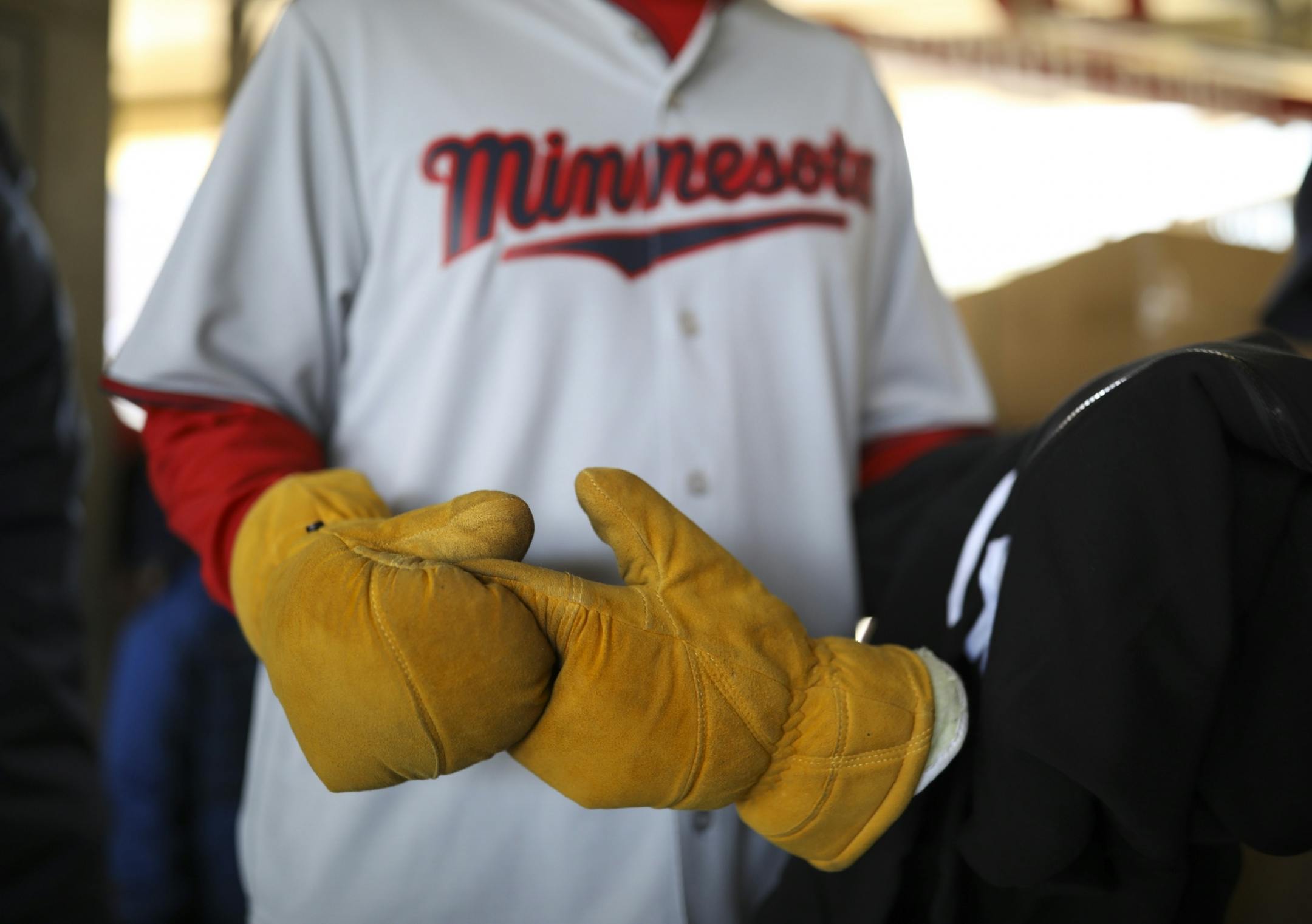 Proper gloves for and opening day in the 30's. Plus the Twins gave out sweatshirts to fans as they entered the gates.