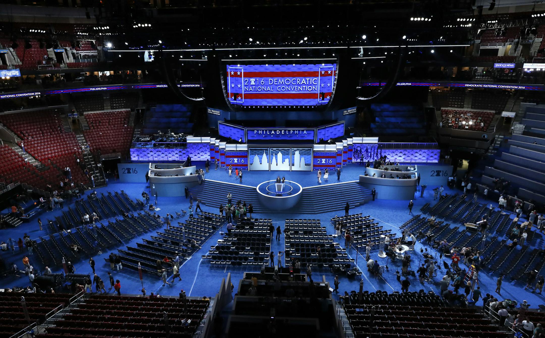 FILE - In this July 24, 2016, file photo, workers prepare for the Democratic National Convention in Philadelphia. Democratic presidential candidate former Vice Presiden JoBiden's presidential nominating convention will highlight the U.S. political spectrum from the left flank of New York Rep. Alexandria Ocasio-Cortez to the Republican old guard of former Ohio Gov. John Kasich. But that doesn't mean there's room for every prominent Democrat who would get a share of the spotlight at a routine conv