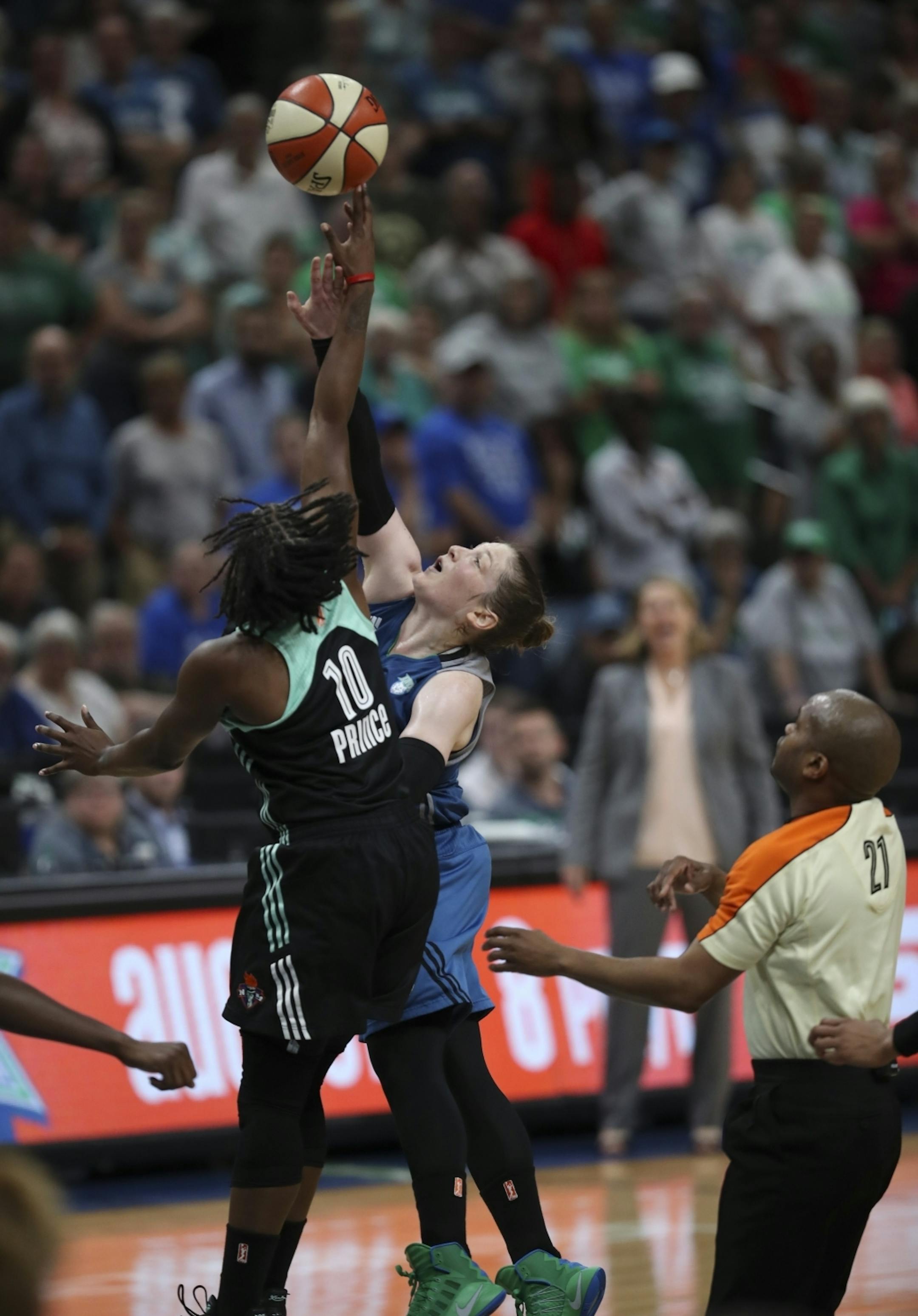 New York Liberty guard Epiphanny Prince (10) guided the ball away from Minnesota Lynx guard Lindsay Whalen (13) during a tipoff with 15 seconds left in the game.