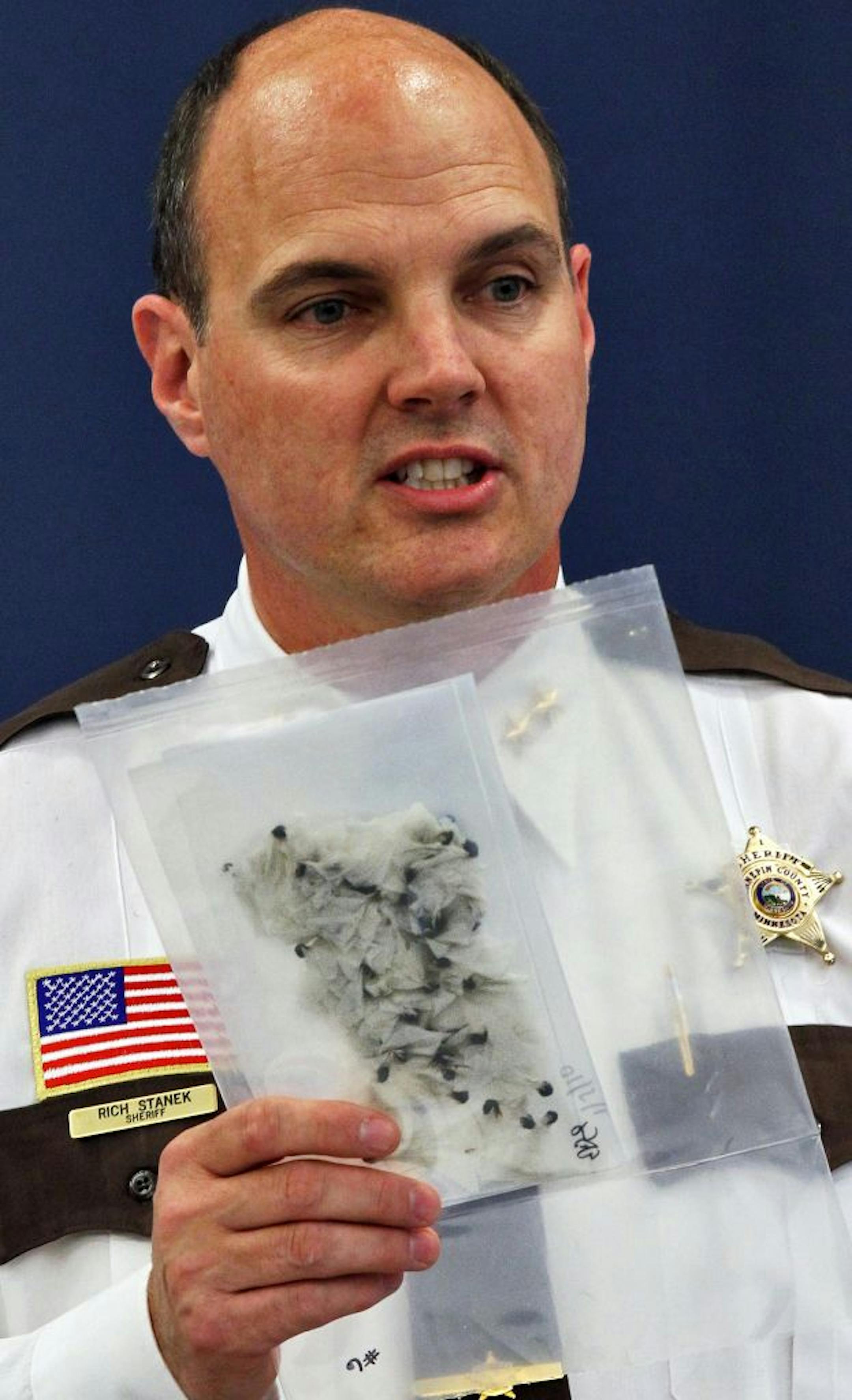 Local law enforcement agencies are seeing an alarming rise in the sale of heroin on streets. Ramsey County Sheriff Matt Bostrom, Hennepin County Sheriff Rich Stanek and Anoka County Sheriff James Stuart held a press conference to point out law enforcement efforts to combat the trend. Hennepin County Sheriff Rich Stanek held up a package of heroin recovered by law enforcement officers. (MARLIN LEVISON/STARTRIBUNE(mlevison@startribune.com
