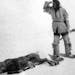 This Roland W. Reed photo from 1908 of an Ojibway Indian claimed to be of the last caribou shot in Minnesota.