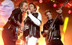John Taylor, left, Simon Le Bon and Dom Brown of the band Duran Duran perform in concert during their &#x201c;Paper Gods Tour 2016&#x201d; at the Veri