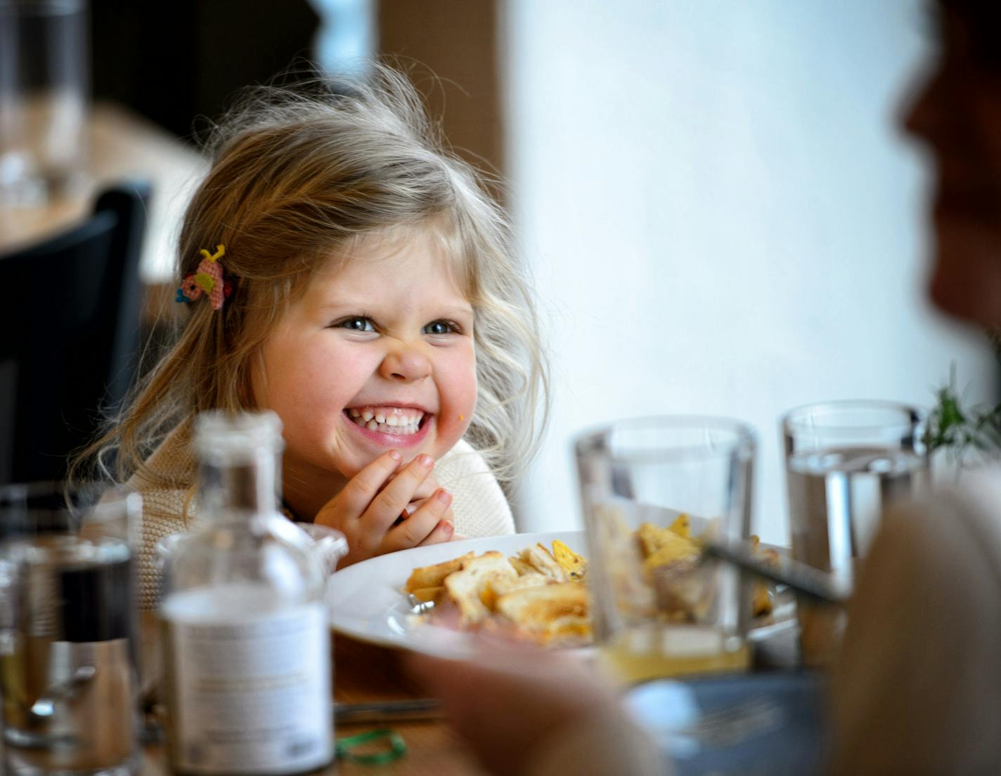 Chloe Sletten, age 4, laughed with her mom Courtney over a grilled-cheese sandwich at Co-op Creamery.