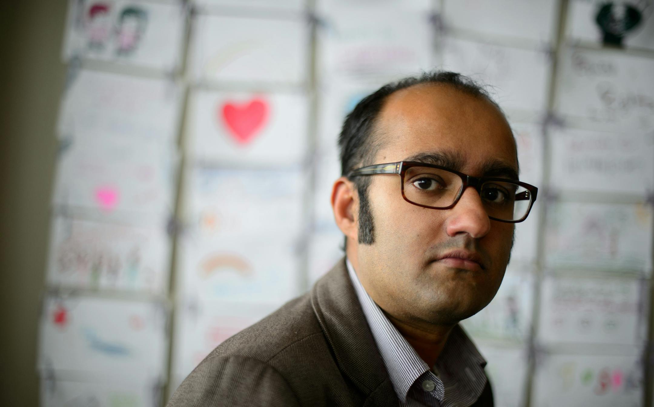 Deepinder Mayell, program director of Refugee and Immigration at the Advocates for Human Rights in Minneapolis. Behind him are children's drawings from the State Fair of what human rights means to them. Mayell is concerned that Somalis being deported could be killed or prosecuted if returned to Somalia. ] GLEN STUBBE * gstubbe@startribune.com