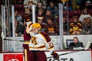The puck bounced off Gophers freshman Jimmy Clark’s helmet during the Nov. 3 victory against Minnesota Duluth in Minneapolis.
