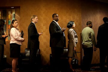 Hundreds of job seekers waited in line to search for job opportunities at the Minneapolis Career Fair in Bloomington, Monday, September 12, 2011