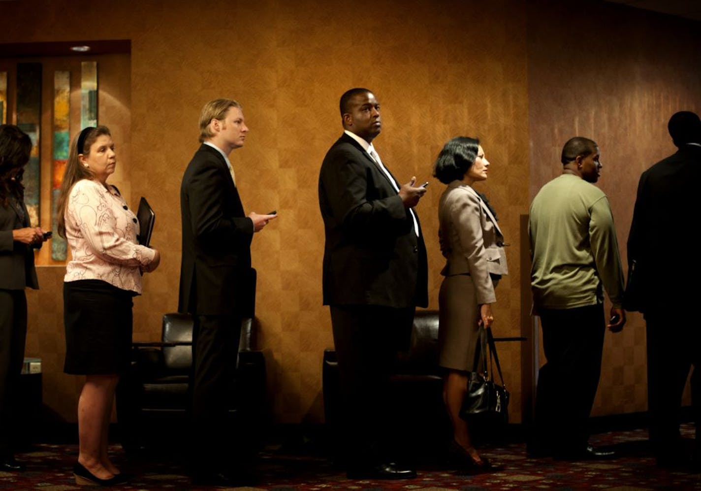 Hundreds of job seekers waited in line to search for job opportunities at the Minneapolis Career Fair in Bloomington, Monday, September 12, 2011