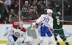 Minnesota Wild left wing Zach Parise (11), behind the net, scored the game winner in the third period, with an assist from center Mikko Koivu (9) and 