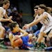 Shai Anye Wesley of Washburn was surrounded by Park Center players left to right McKenna DuBois, Danielle Schaub, and Ann Simonet during class 3A semi