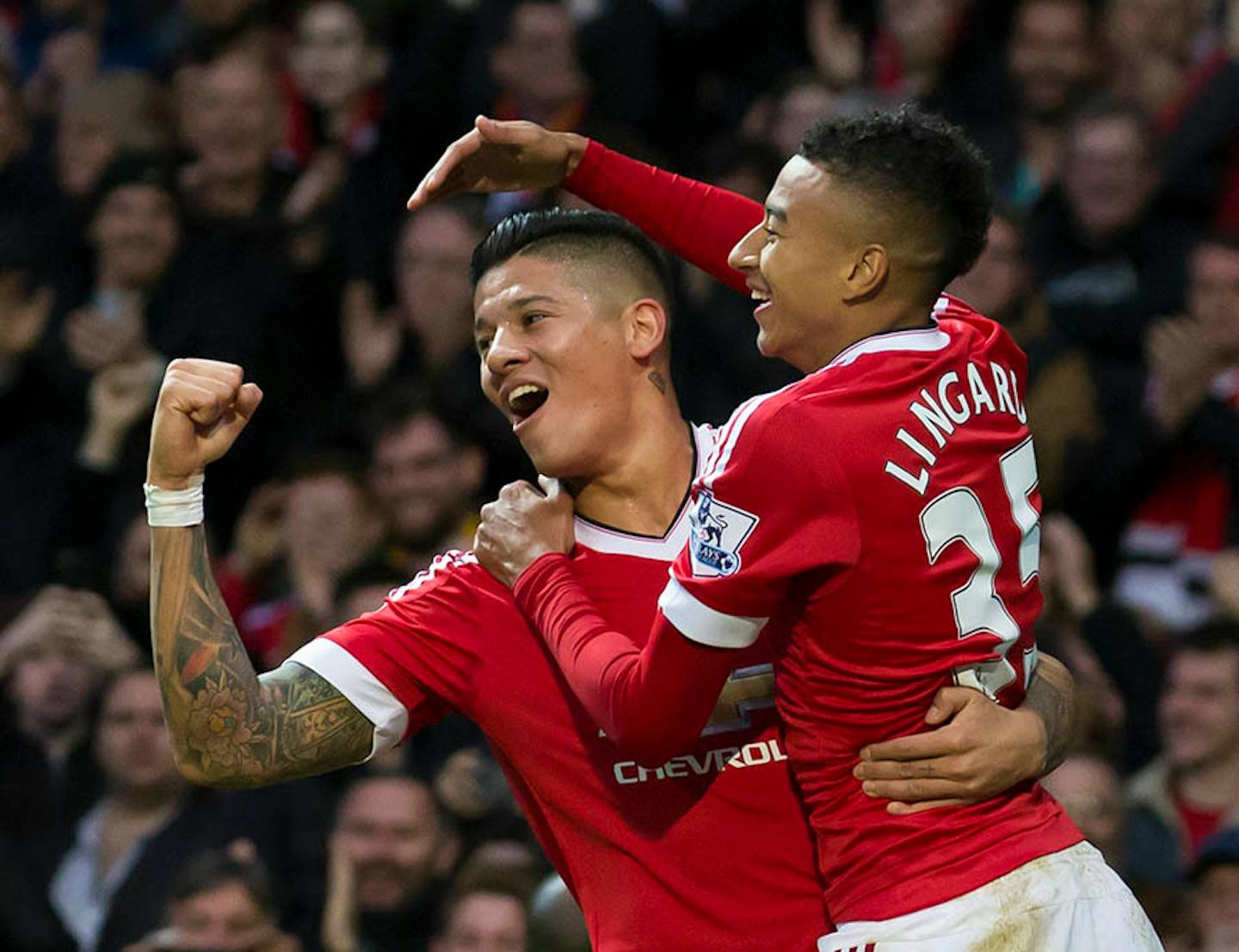 Manchester United's Jesse Lingard, right, celebrates with teammate Marcos Rojo after scoring during the English Premier League soccer match between Manchester United and West Bromwich Albion at Old Trafford Stadium, Manchester, England, Saturday, Nov. 7, 2015. (AP Photo/Jon Super)