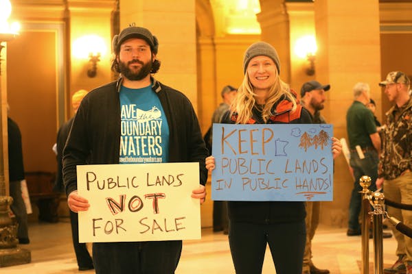 Pat Winninger, 33, left, and Ingrid Aune, 26, attended the Rally for Pulic Lands Thursday at the Capitol in St. Paul. Winniger manages the St. Paul Pa
