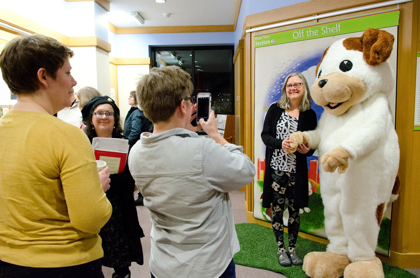 Visitors to the ABC exhibit pose with their favorite picture-book characters.