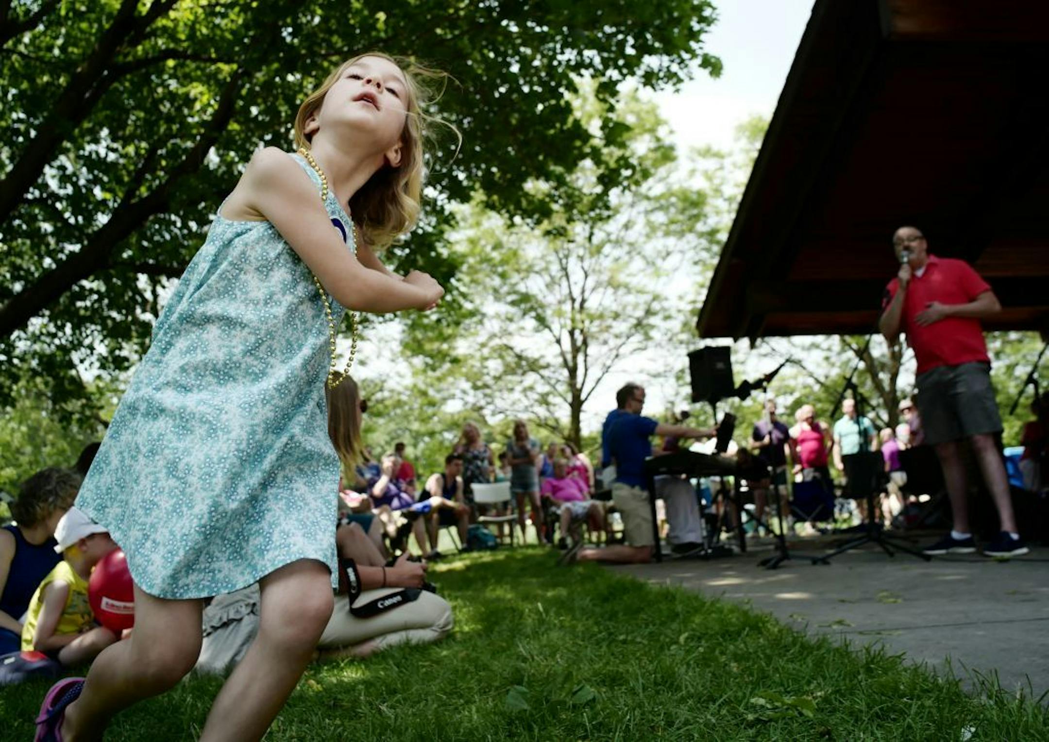 Zoey Shad,5, danced her own interpretation of a tune while a member of the Twin Cities Gay Men's Chorus sang at Brookview Park, where the LGBT community in Golden Valley celebrated Pride weekend but also remembered the tragedy in Orlando that took the lives of 50 people.