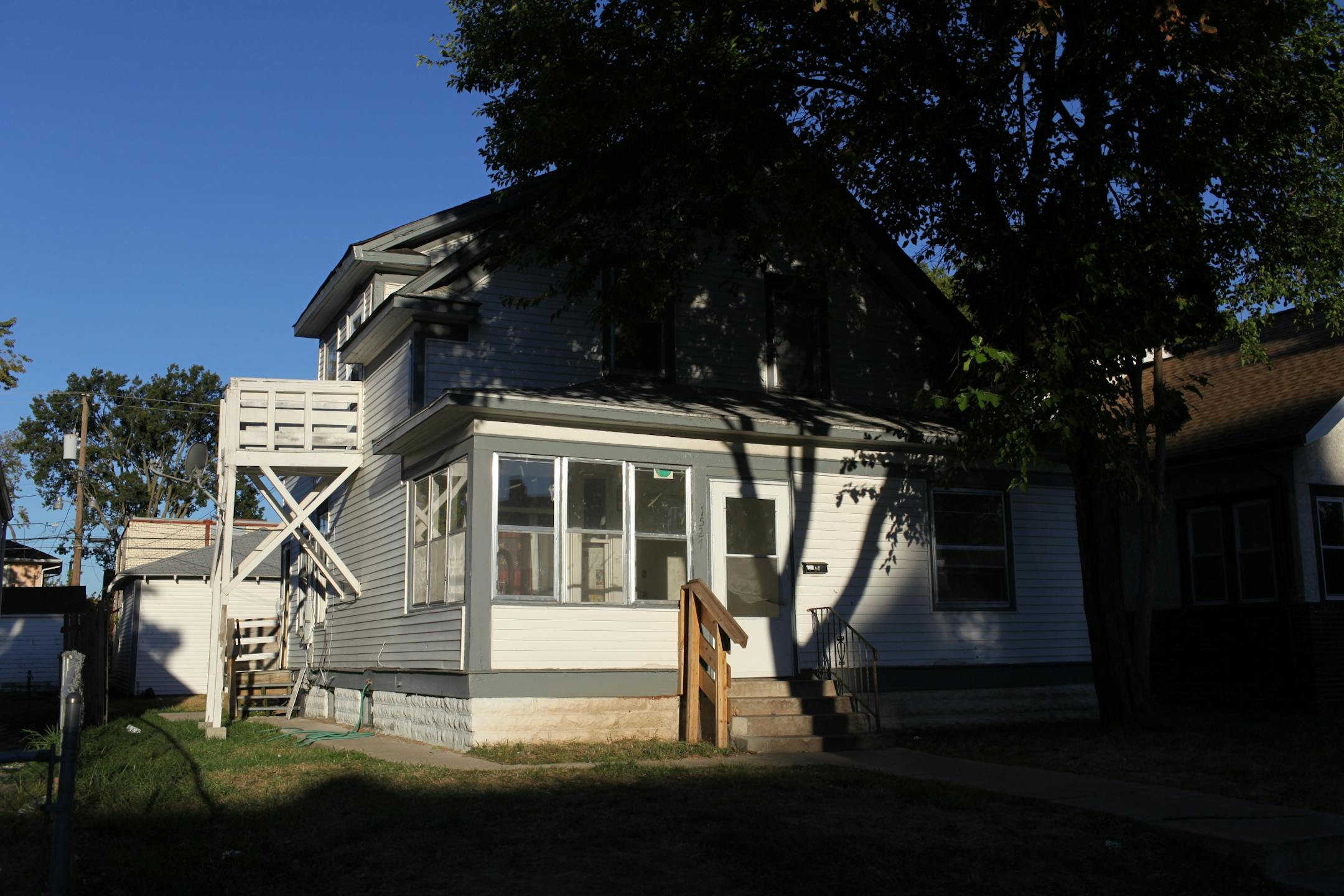 Exterior of the home at 1527 Queen Ave. North. Wednesday evening someone fired at least 11 shots into the home throught a first floor window, wounding two men, a woman and a child who were taken to nearby North Memorial Medical Center and were expected to survive.