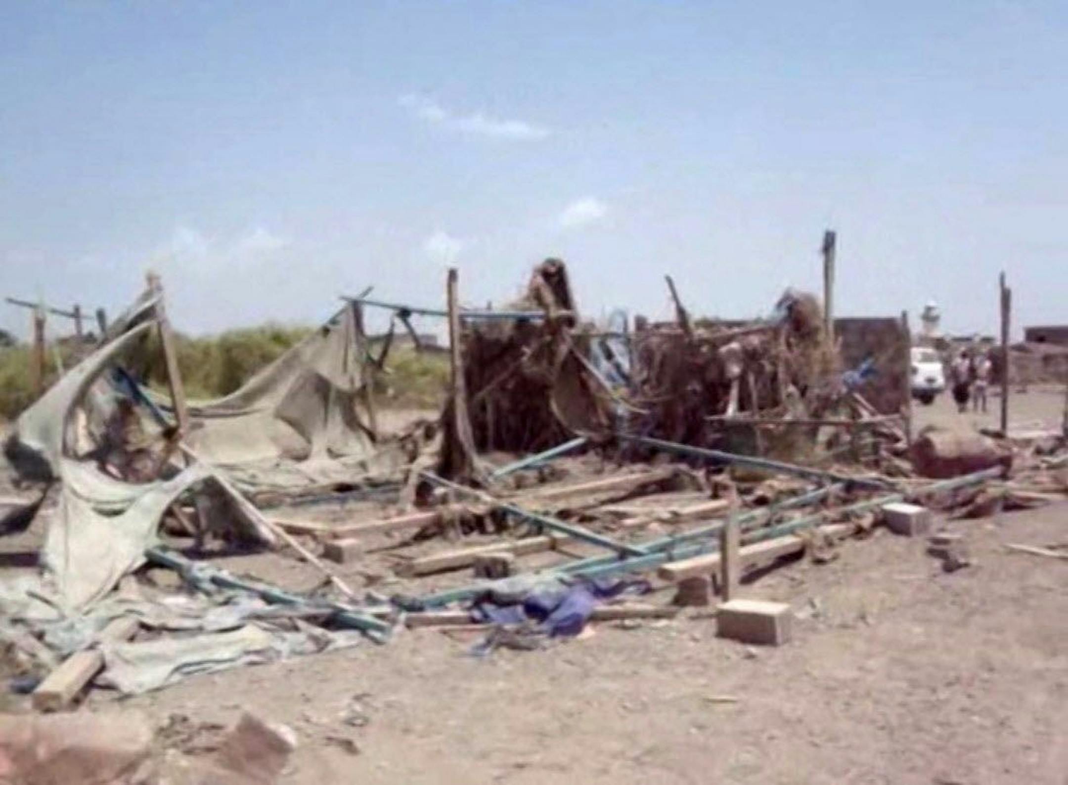 This still image taken from video shot on Monday, Sept. 28, 2015, shows destruction to buildings after an air strike hit a wedding party in al-Wahga, a village near the strategic Strait of Bab al-Mandab, Yemen. The death toll from Saudi-led airstrikes that hit a wedding party in Yemen's central Taiz province has risen to 131, making it the deadliest single incident since the start of the country's civil war, medical officials said Tuesday.