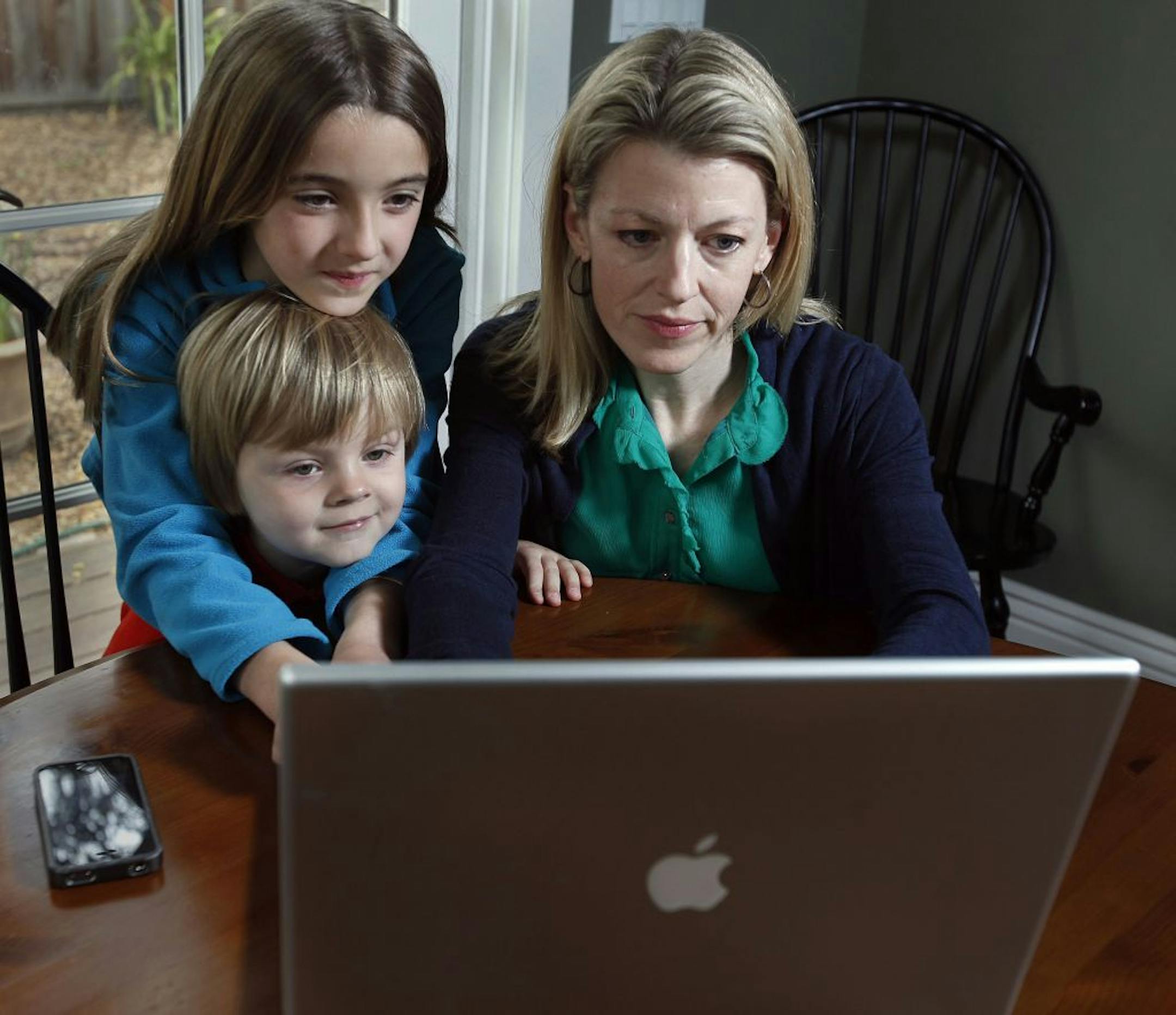 Christine Egy Rose, CEO and founder of Scoot & Doodle, showed her 8-year-old daughter Cate and 3-year-old son Jackson the new software her company is developing for use on Hangout. Her company is among developers diving in to create apps for the Google+ feature