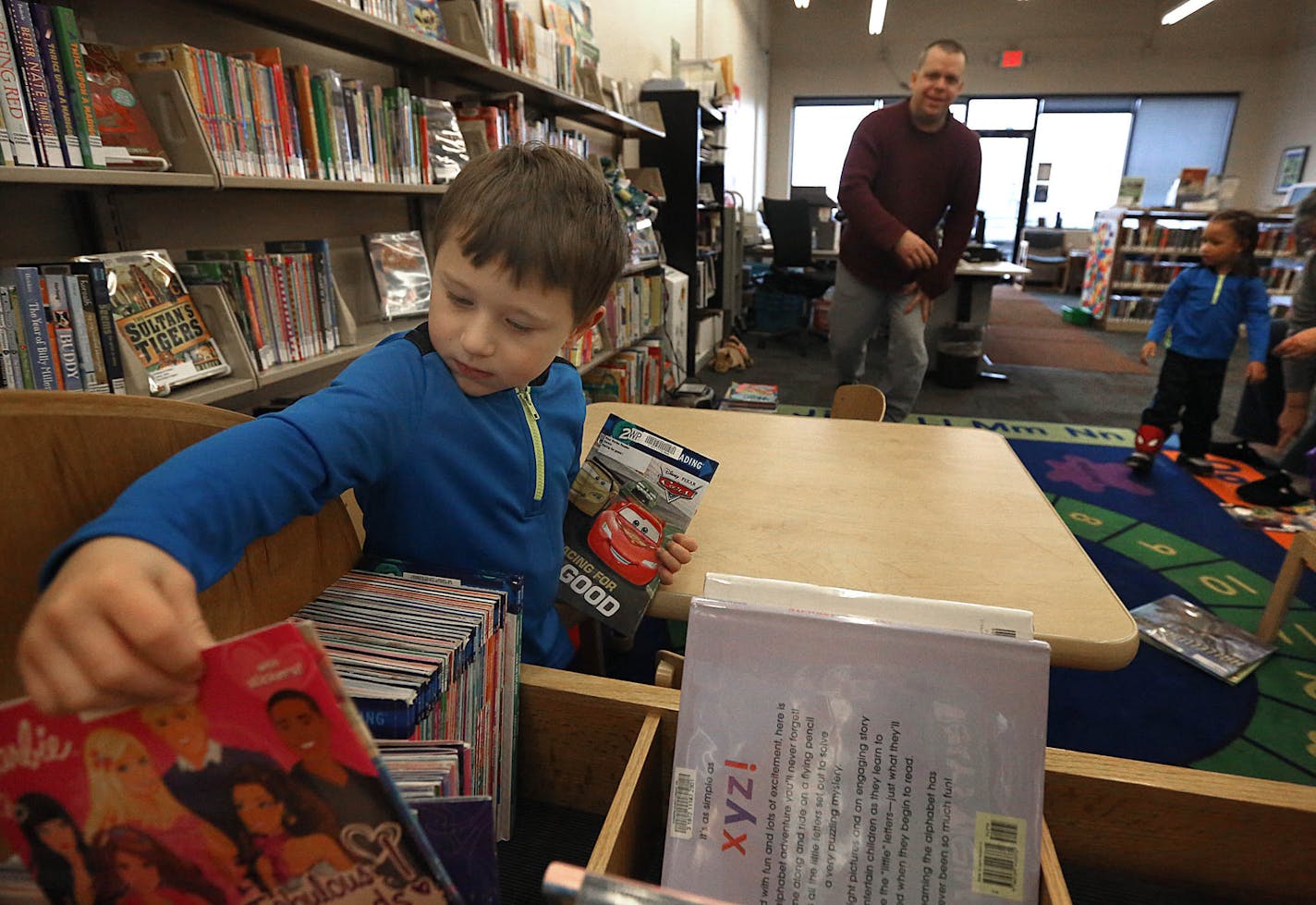 Jacob Brogan, 5, looked for reading options at the Webber Park Library. ] JIM GEHRZ &#x201a;&#xc4;&#xa2; james.gehrz@startribune.com / Minneapolis, MN / November 22 2014 /10:00 AM - BACKGROUND INFORMATION: The last piece of unfinished business from the massive library referendum passed by Minneapolis voters is finally gaining momentum. The renovation of Webber Park library has morphed into a $15 million replacement that's tentatively set to open in 2017. The county is footing the bill for much o