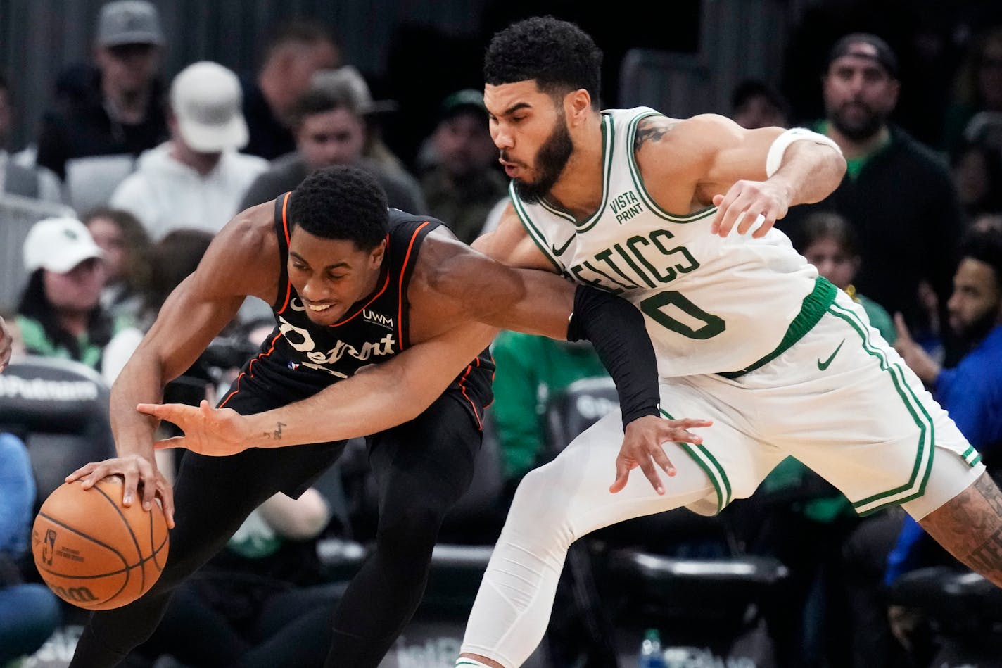 Celtics forward Jayson Tatum battled Pistons guard Jaden Ivey for the ball during the second half Thursday