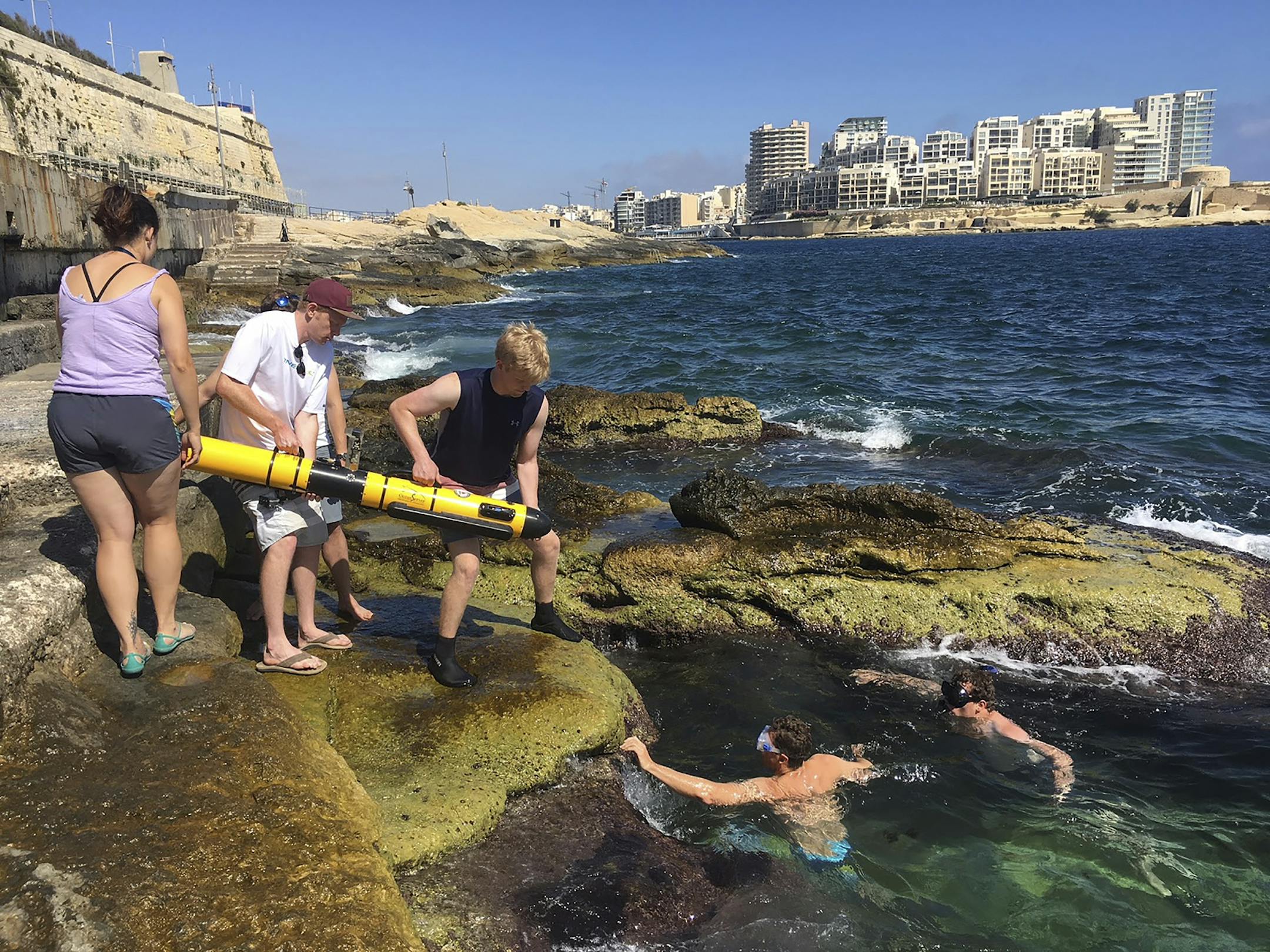 **EMBARGO: No electronic distribution, Web posting or street sales before 3:01 a.m. ET Tuesday, Nov. 24, 2020. No exceptions for any reasons. EMBARGO set by source.** In an undated photo from Dr. Zoe Wood/Harvey Mudd College, researchers from Cal Poly SLO, Harvey Mudd College and the University of Malta deploy an autonomous underwater vehicle from the Malta coast. (Dr. Zoe Wood/Harvey Mudd College via The New York Times) -- NO SALES; FOR EDITORIAL USE ONLY WITH NYT STORY SCI AI ARCHAEOLOGY BY ZA