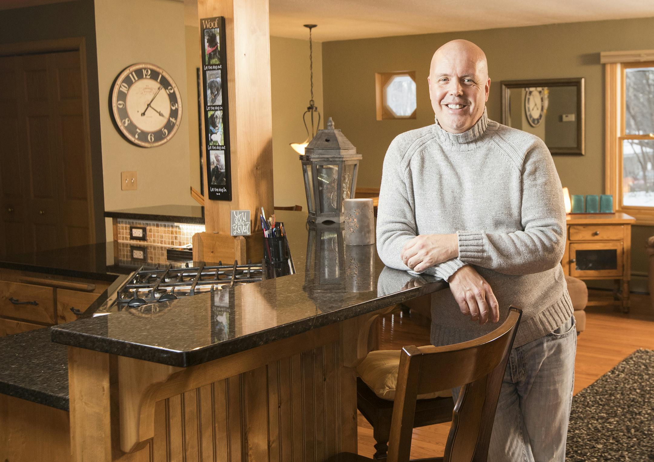 Lane Christianson at the island in his kitchen.