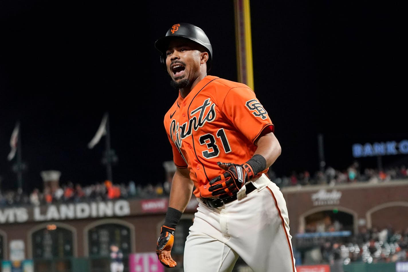 San Francisco Giants' LaMonte Wade Jr. reacts after hitting a home run against the Atlanta Braves during the fourth inning of a baseball game in San Francisco, Friday, Sept. 17, 2021. (AP Photo/Jeff Chiu)